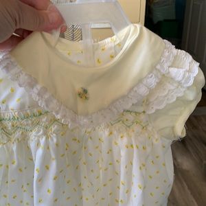 Yellow and white baby girl dress with white lace on sleeves and yellow flowers